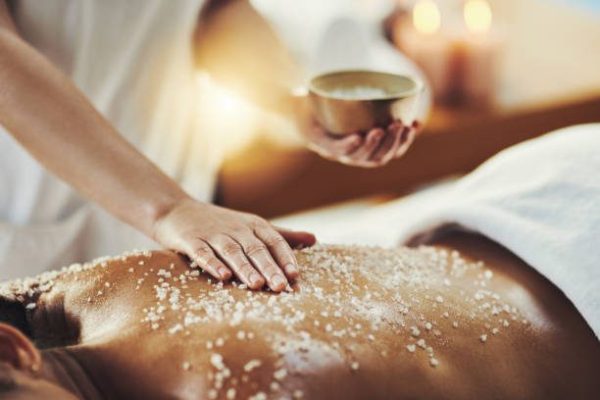 Closeup shot of a woman getting an exfoliating massage at a spa Closeup shot of a woman getting an exfoliating massage at a spa